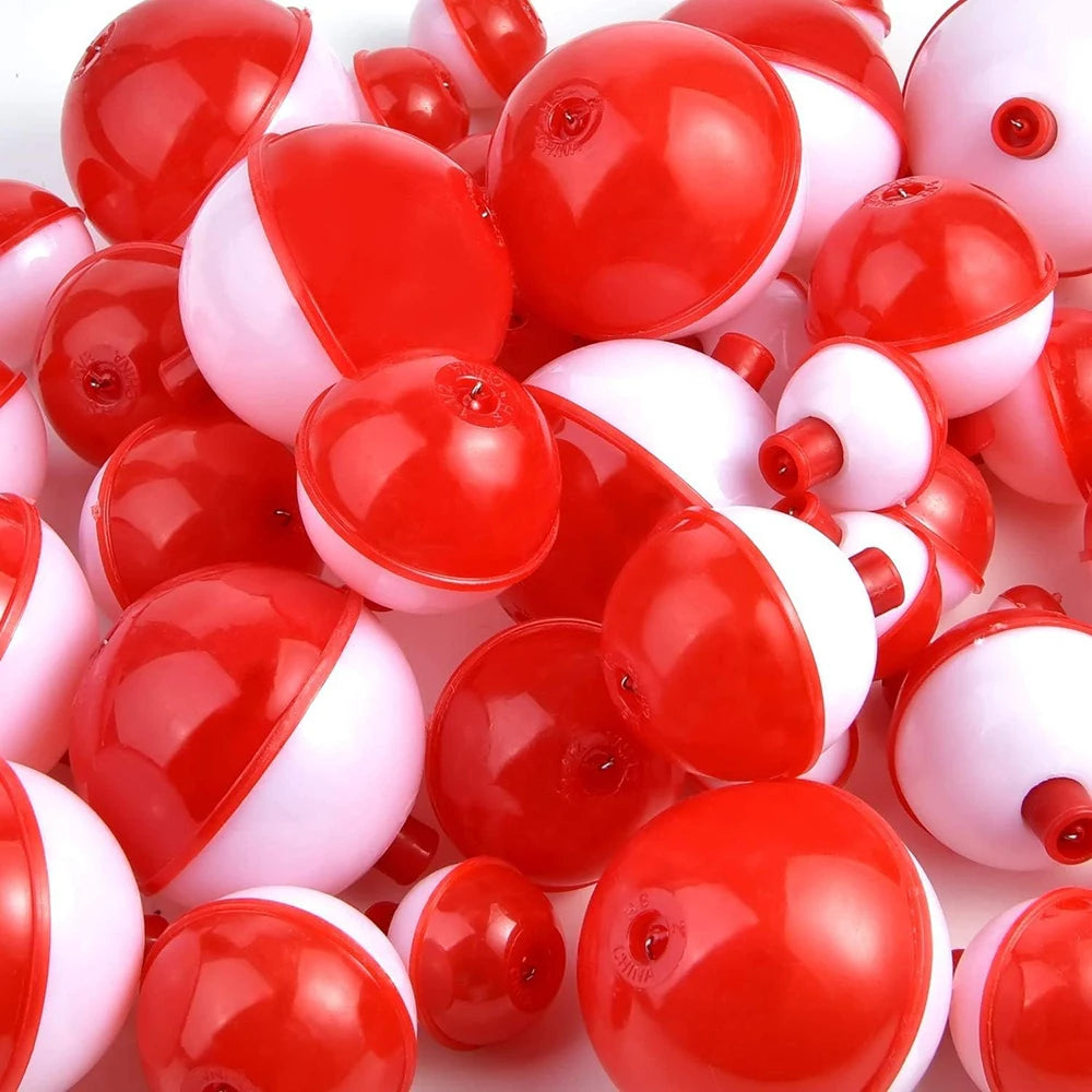 Red and white plastic fishing bobbers for outdoor gear and fishing accessories