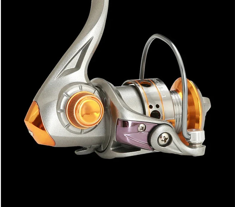 Close-up of a metallic spinning fishing reel with gold accents on a black background