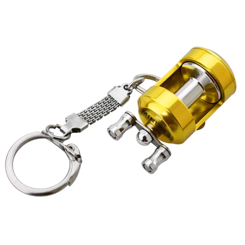 Miniature Gold Fishing Reel Keychain by HookUpCo. - HookUpCo.