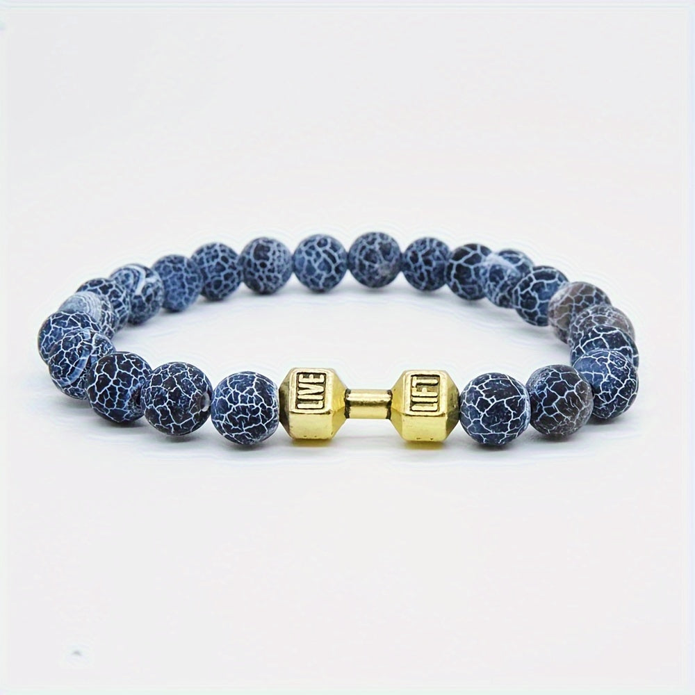 Bracelet with blue beads and gold dumbbell charm on a white background