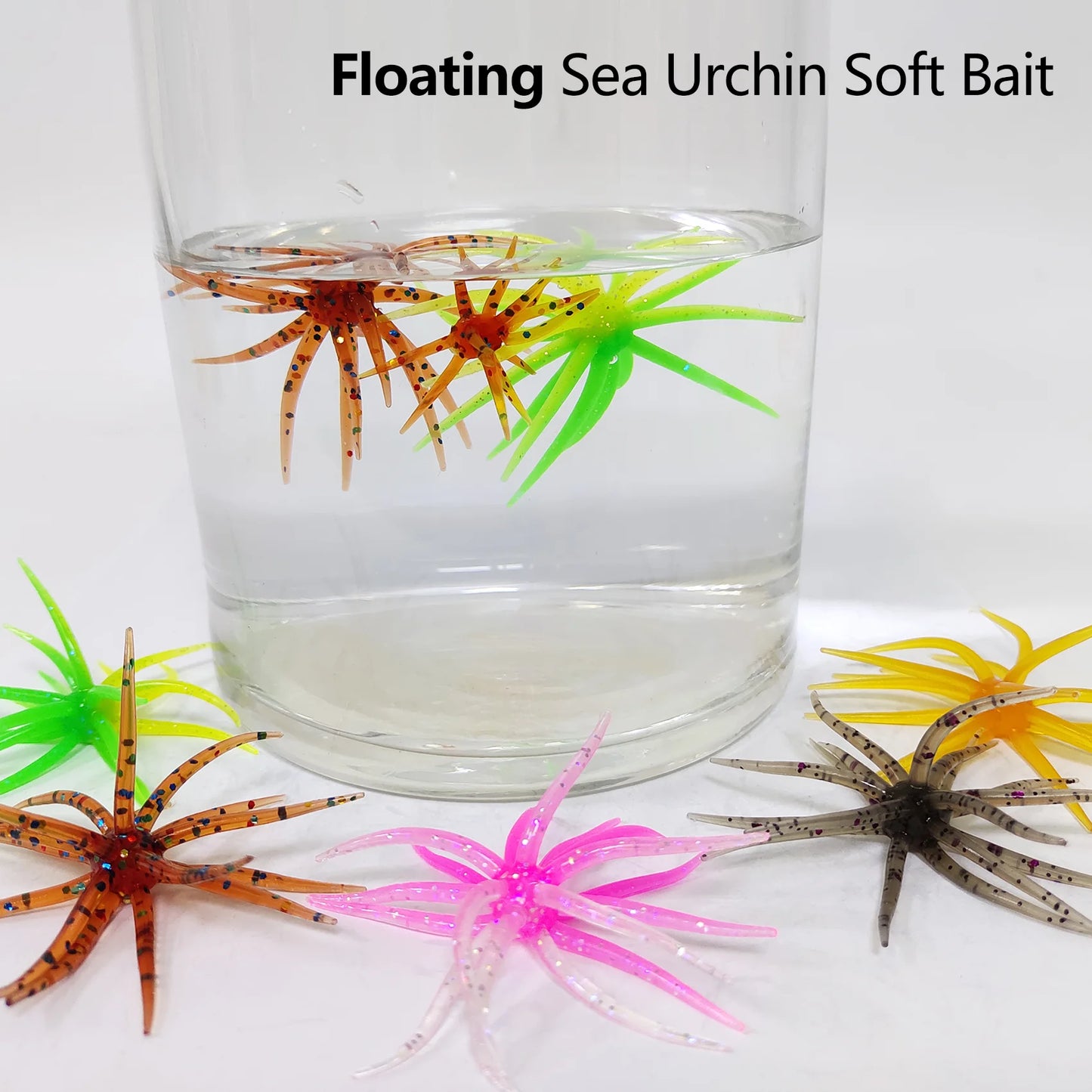 Colorful floating sea urchin soft bait fishing lures in a glass of water and on a white surface.