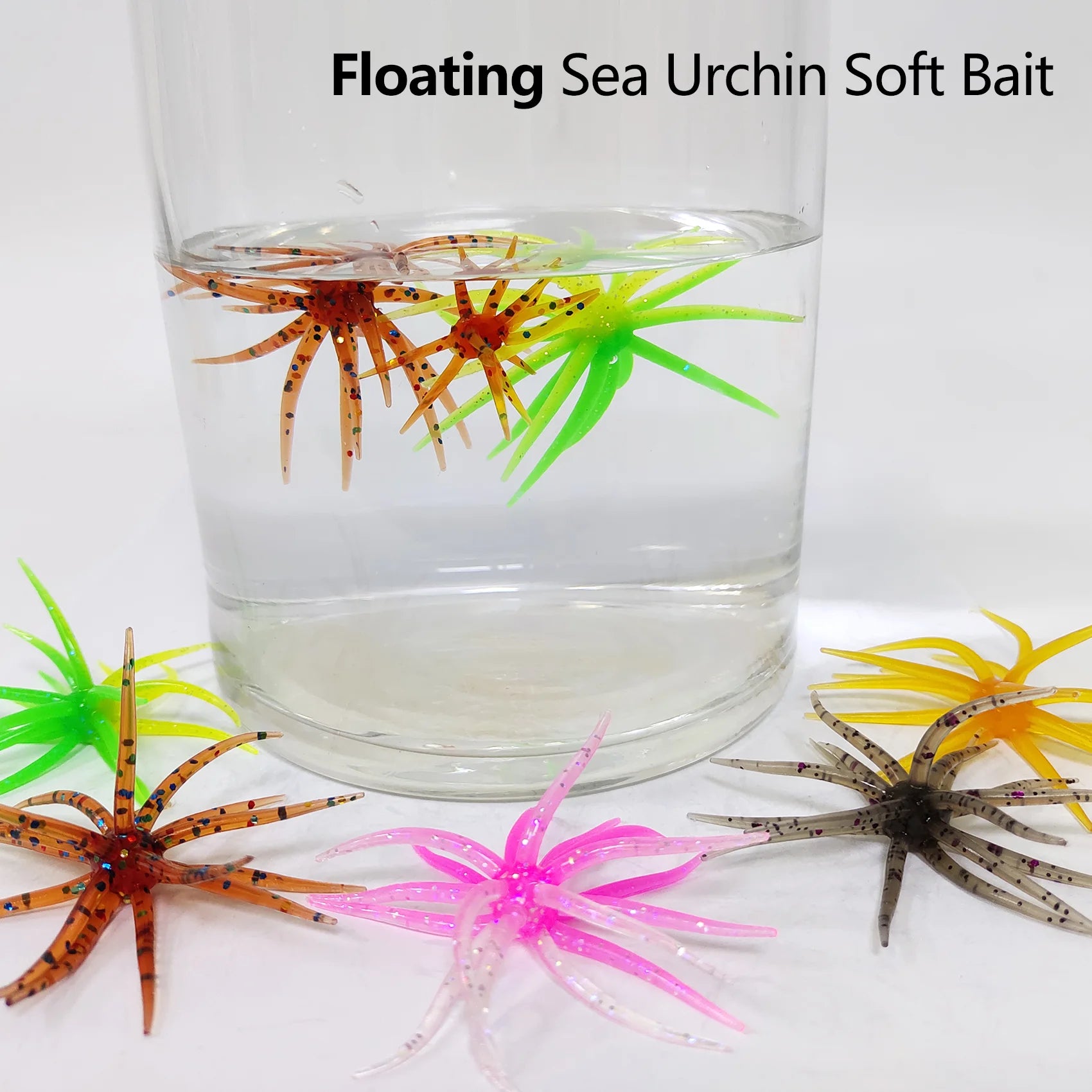 Colorful floating sea urchin soft bait fishing lures in a glass of water and on a white surface.