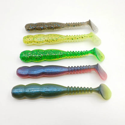 Assorted soft plastic fishing lures in green, yellow, and blue for outdoor fishing gear.