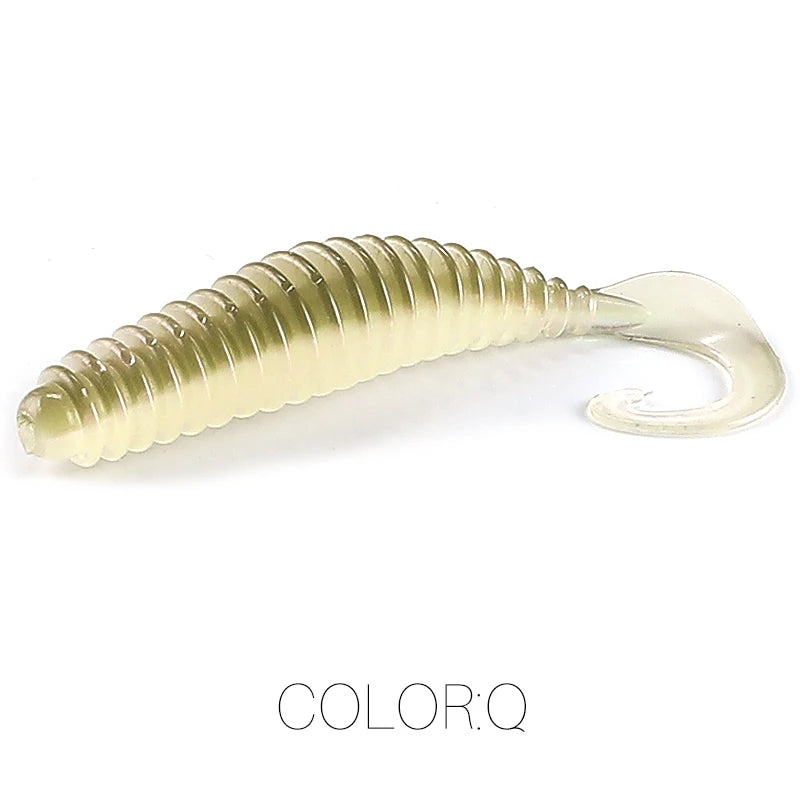 Soft plastic fishing lure in translucent beige with ribbed body and curly tail, color Q.