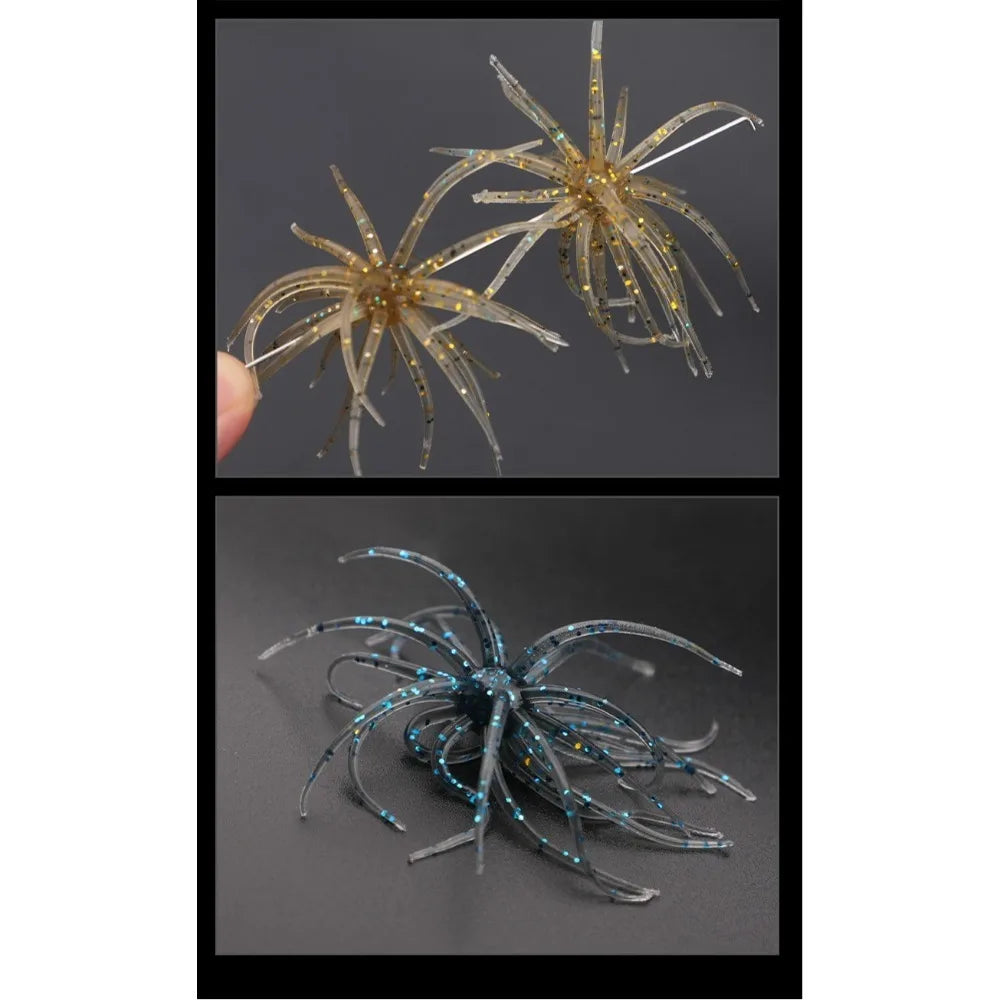 Soft plastic spider-shaped fishing lures in gold and blue on dark background