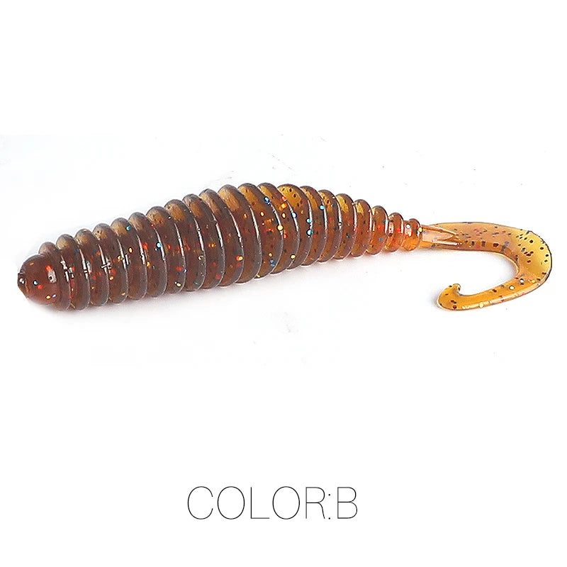 Brown ribbed soft plastic fishing lure with curly tail and glitter accents, isolated on white