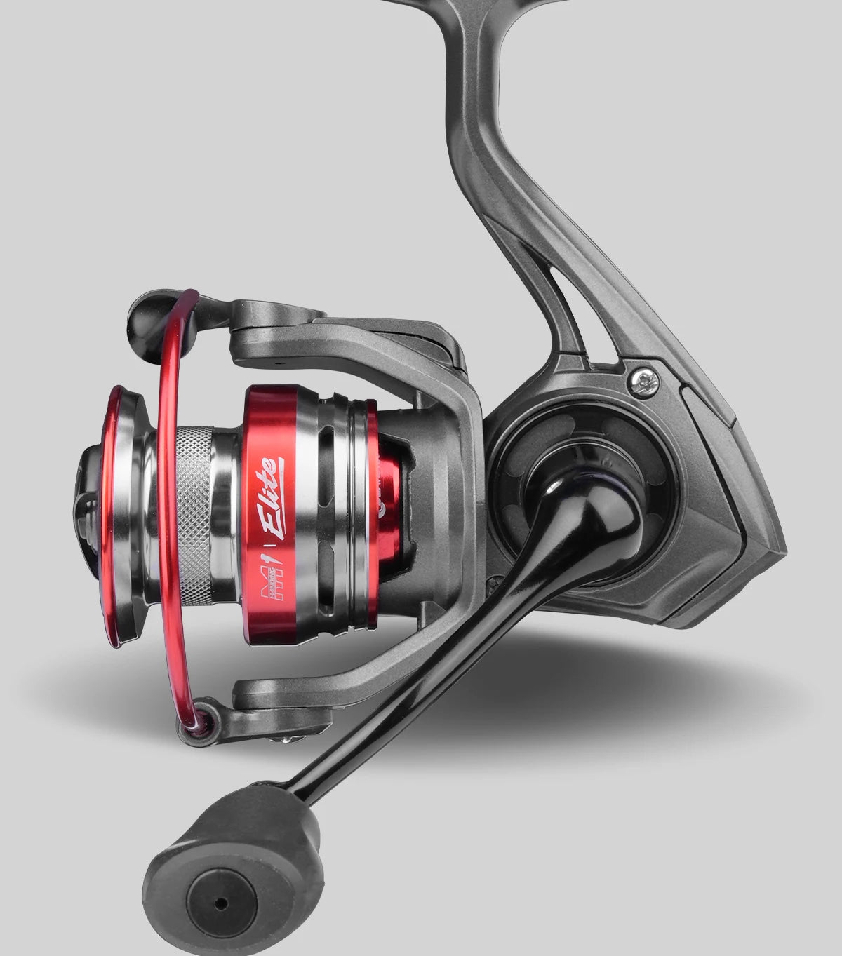 Close-up of a modern spinning fishing reel with red and silver accents on a grey background