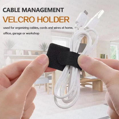 Black Velcro cable straps holding white cords for tidy cable management.