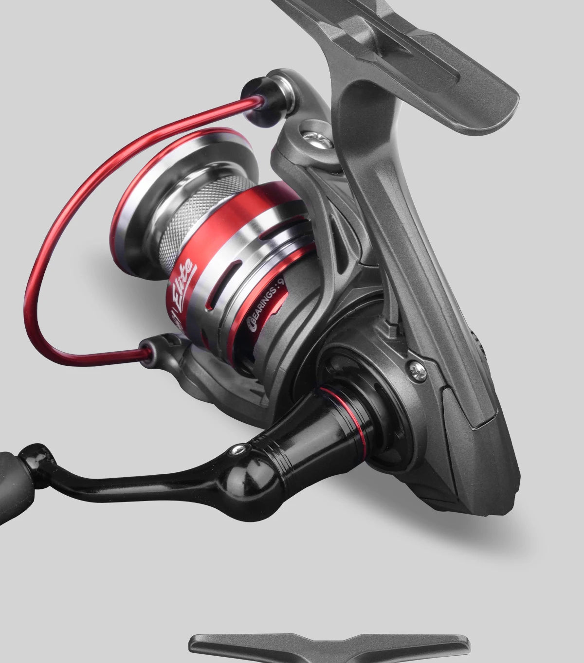 Close-up of a spinning fishing reel with red accents, outdoor gear accessory
