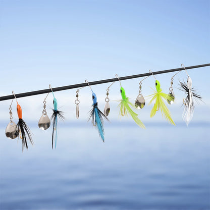 Colorful fishing lures with feathers on a rod, set against a calm lake background