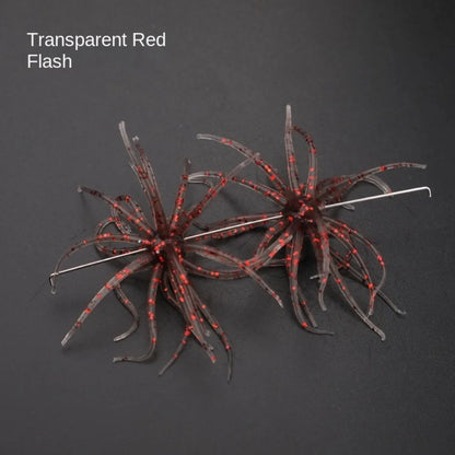 Transparent red flash silicone fishing lures with hook on dark background