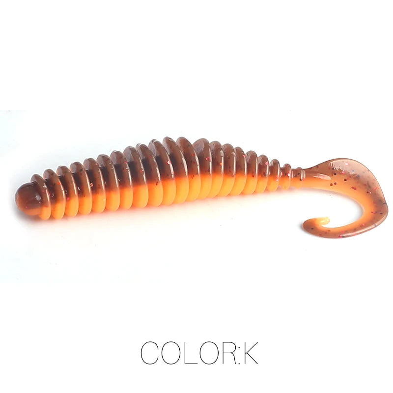 Curly tail soft plastic fishing lure in orange and brown, ribbed design, isolated on white.