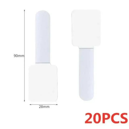 Set of white plastic cable ties with clip, 20 pcs for organizing cords neatly.