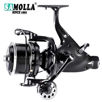 Close-up of a black and silver fishing reel with ergonomic handle and visible branding.