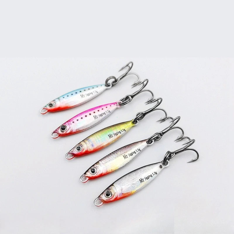 Set of five colorful metal fishing lures with treble hooks on a white background.