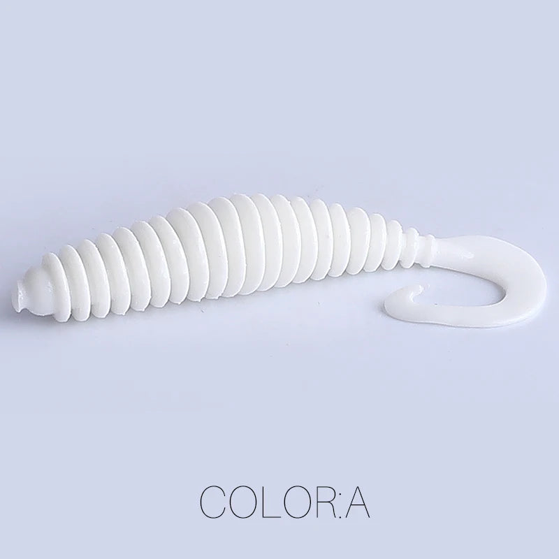 White soft plastic fishing lure with ribbed body and curly tail on light background