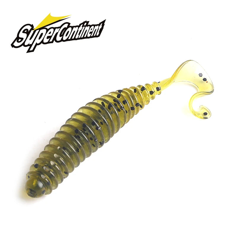 Green ribbed soft plastic fishing lure with curly tail and black specks on white background.
