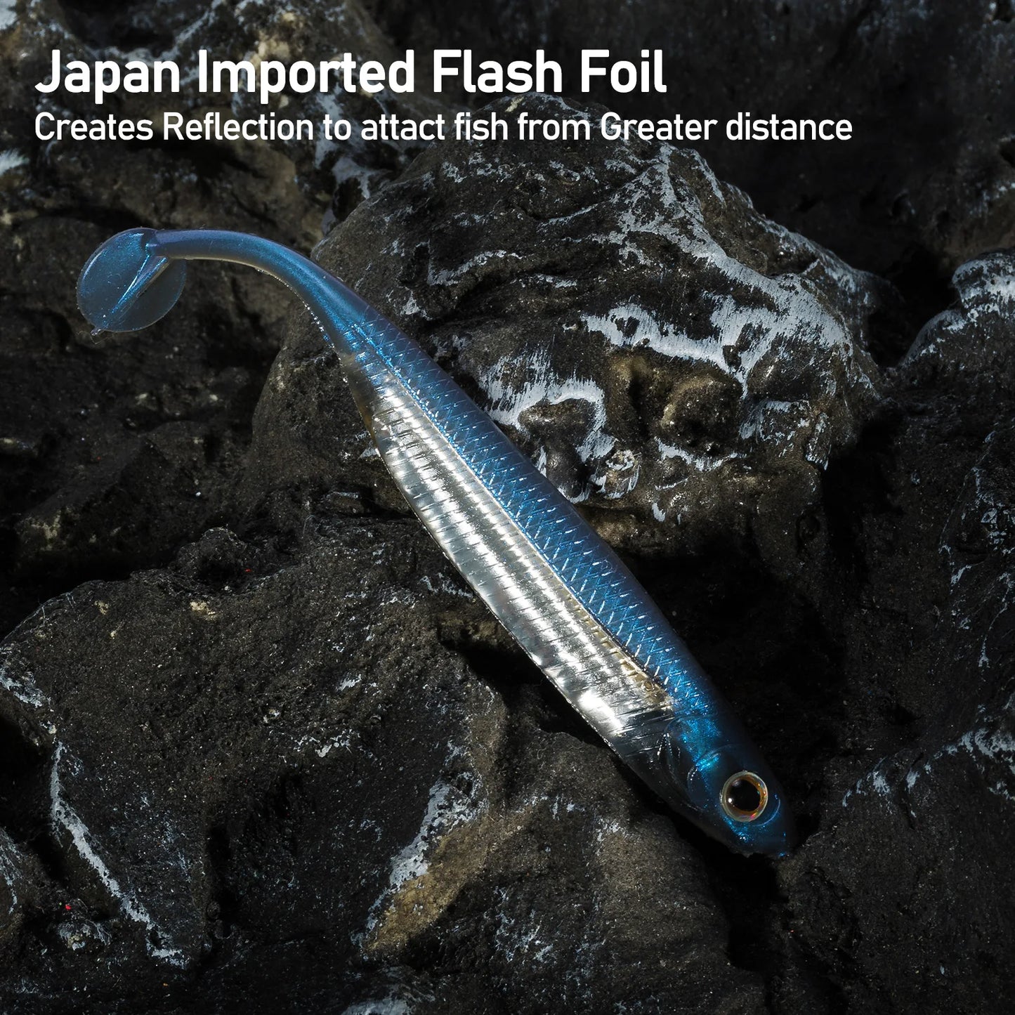Blue and silver fishing lure with Japan imported flash foil on dark rocky surface