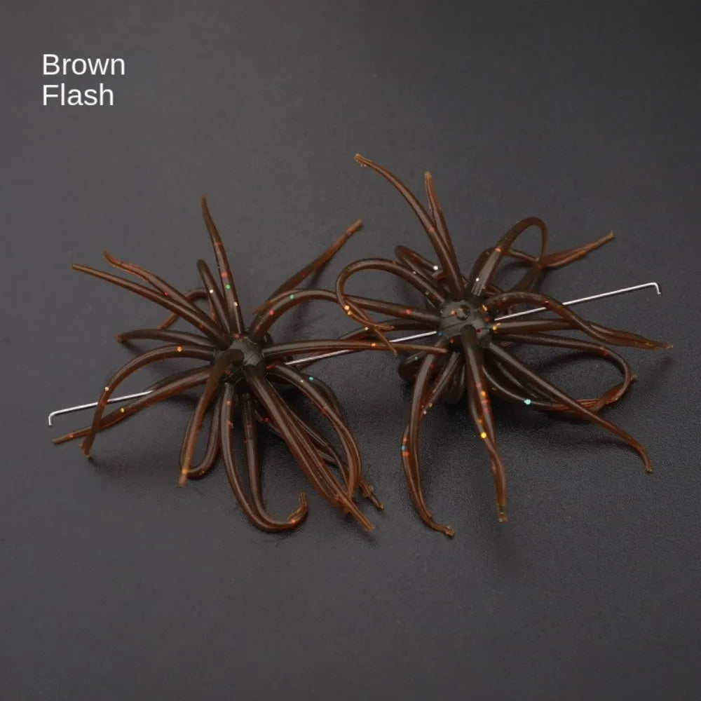 Brown flash artificial fishing lures with multiple tentacles on dark background