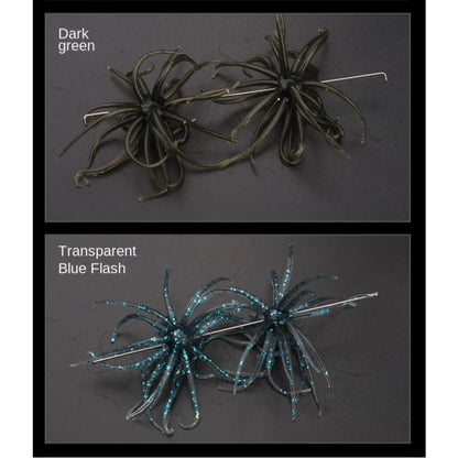 Two artificial soft bait fishing lures in dark green and transparent blue flash on black background.