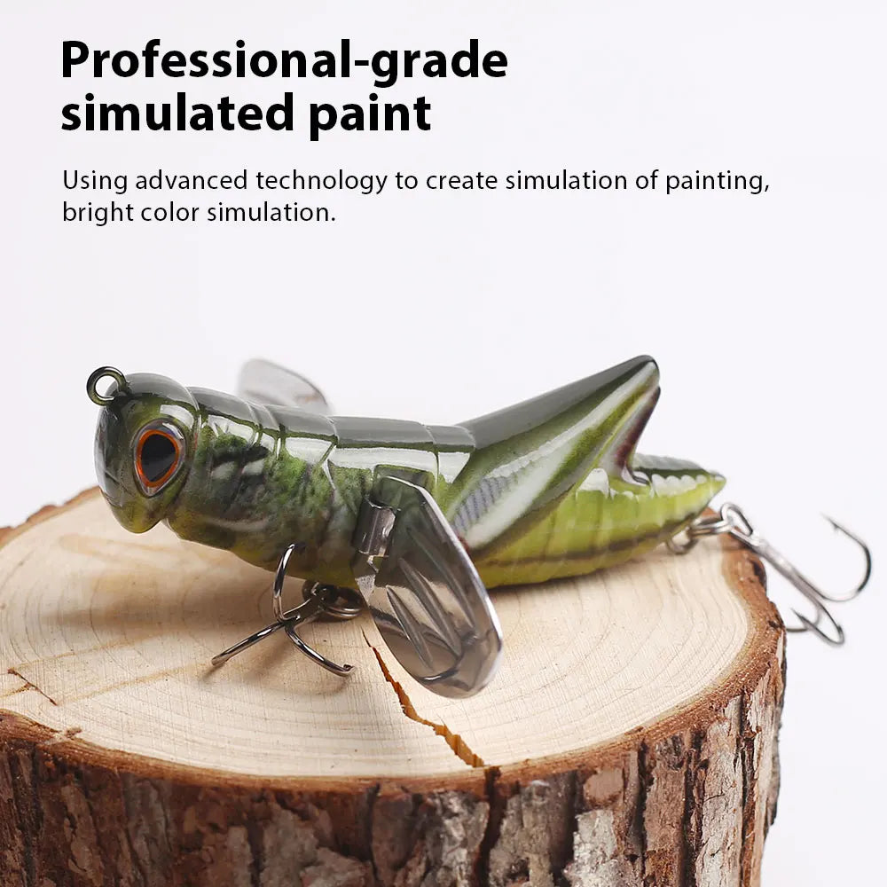 Realistic grasshopper fishing lure with simulated paint, displayed on a tree stump.