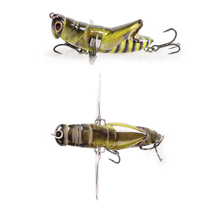 Realistic grasshopper fishing lure with segmented body and treble hooks, isolated on white background.