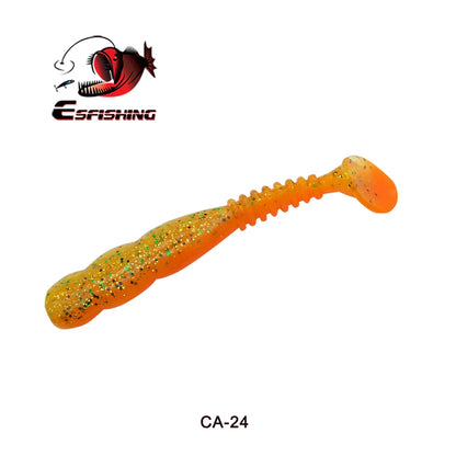 Orange glitter soft plastic fishing lure with paddle tail on white background