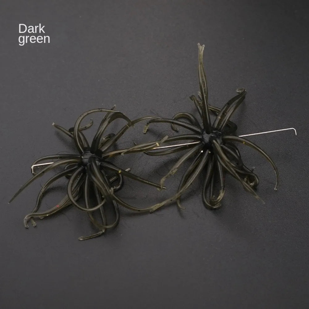 Dark green silicone fishing lures with multiple soft tentacles on a black background