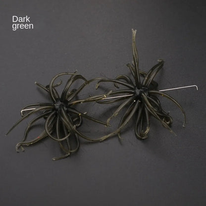 Dark green silicone fishing lures with multiple soft tentacles on a black background