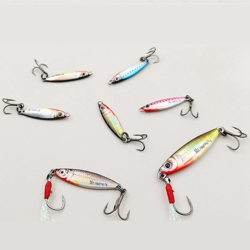 Assorted metal fishing lures with treble hooks, colorful designs for outdoor fishing.