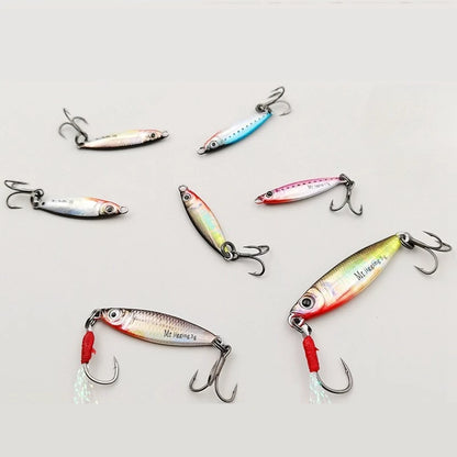 Assorted metal fishing lures with treble hooks, colorful designs for outdoor fishing.