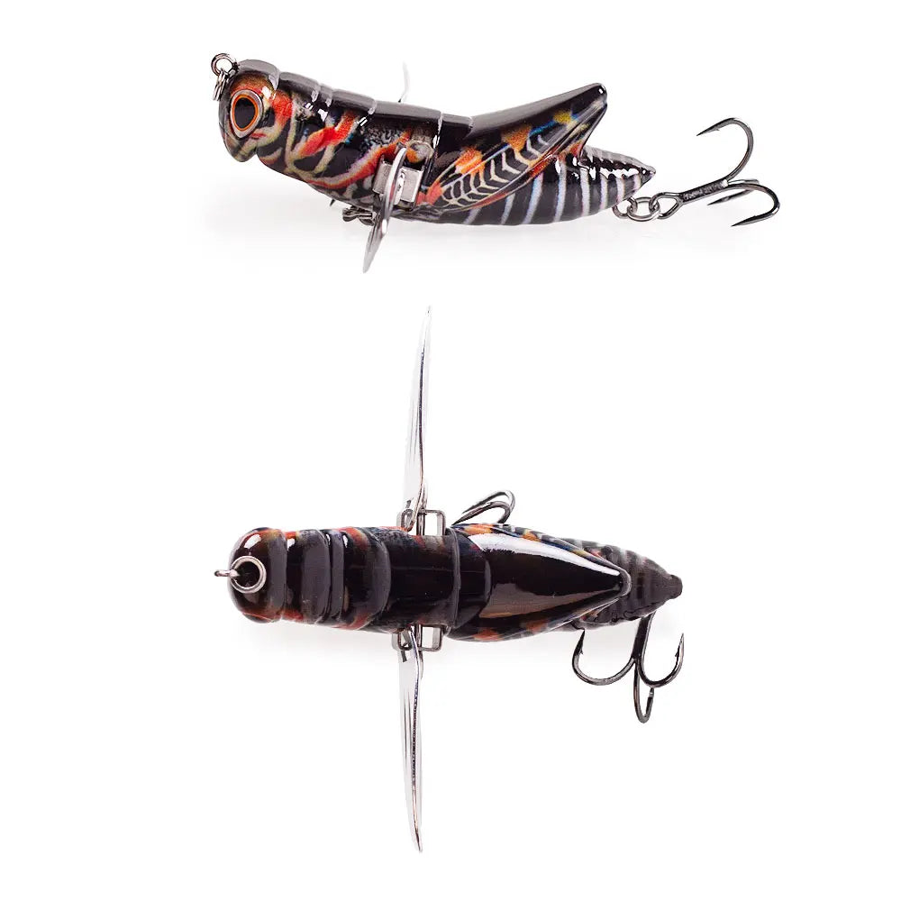 Realistic grasshopper fishing lure with vibrant patterns and treble hooks, isolated on white