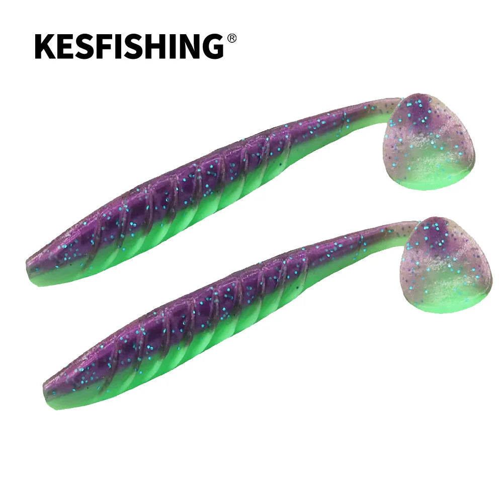 Two soft plastic fishing lures in green and purple with glitter, ideal for freshwater fishing.