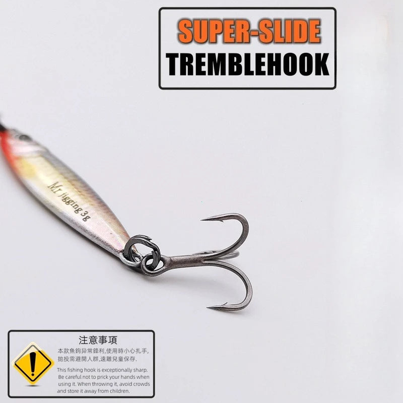 Fishing lure with sharp treble hook, labeled 'super-slide tremblehook,' close-up on white.