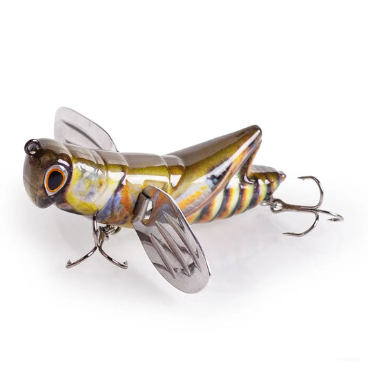 Realistic grasshopper fishing lure with metal wings and treble hooks on white background