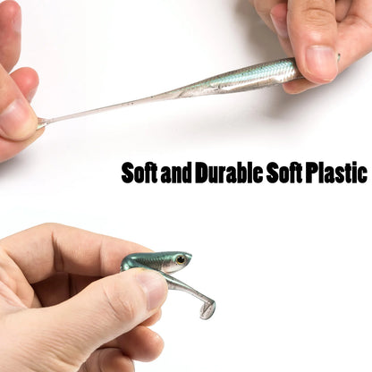 Hands stretching and holding a soft plastic fishing lure with realistic fish details.