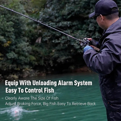 Man fishing by a forest lake using outdoor fishing gear with unloading alarm system.