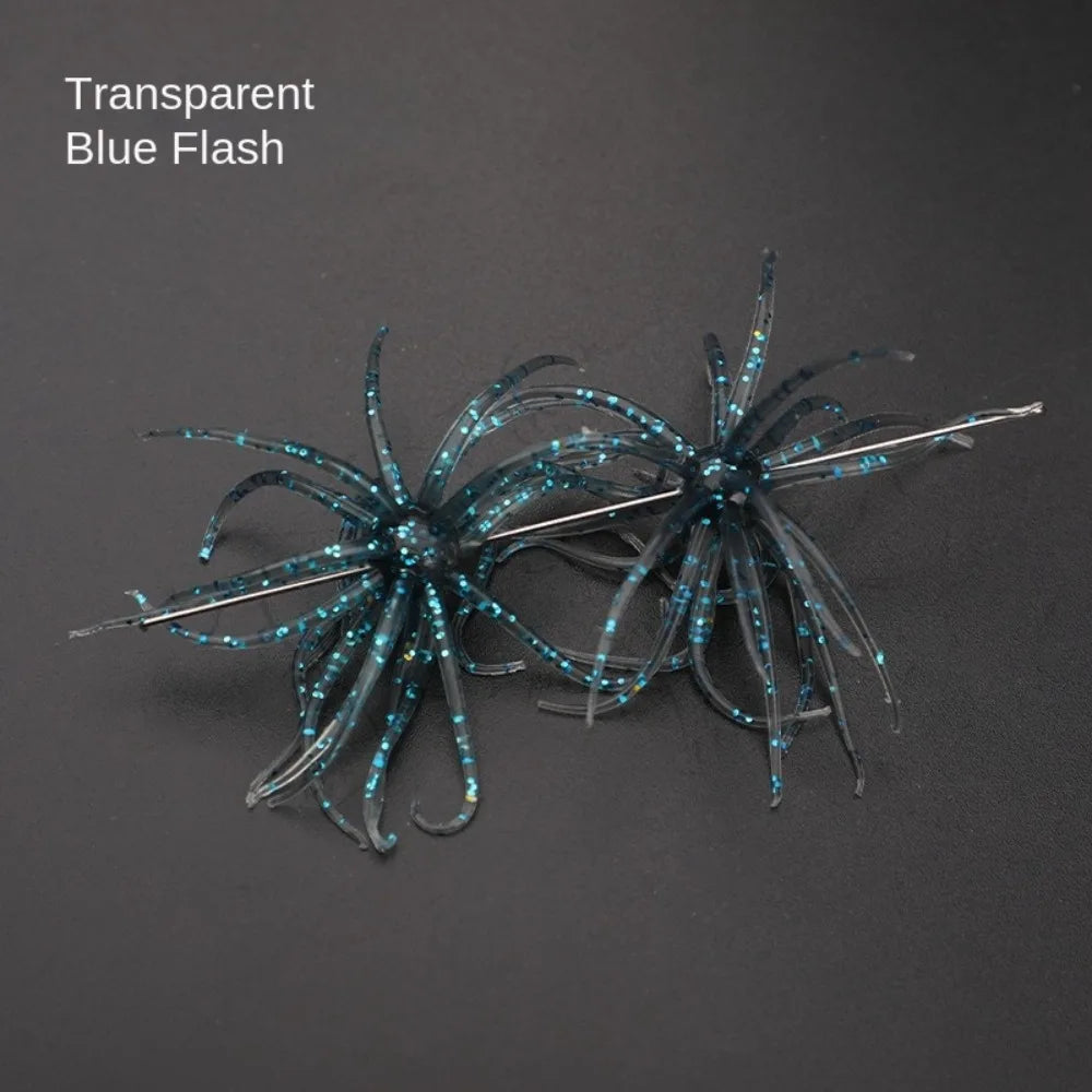 Transparent blue flash soft plastic fishing lure with glitter tentacles on black background
