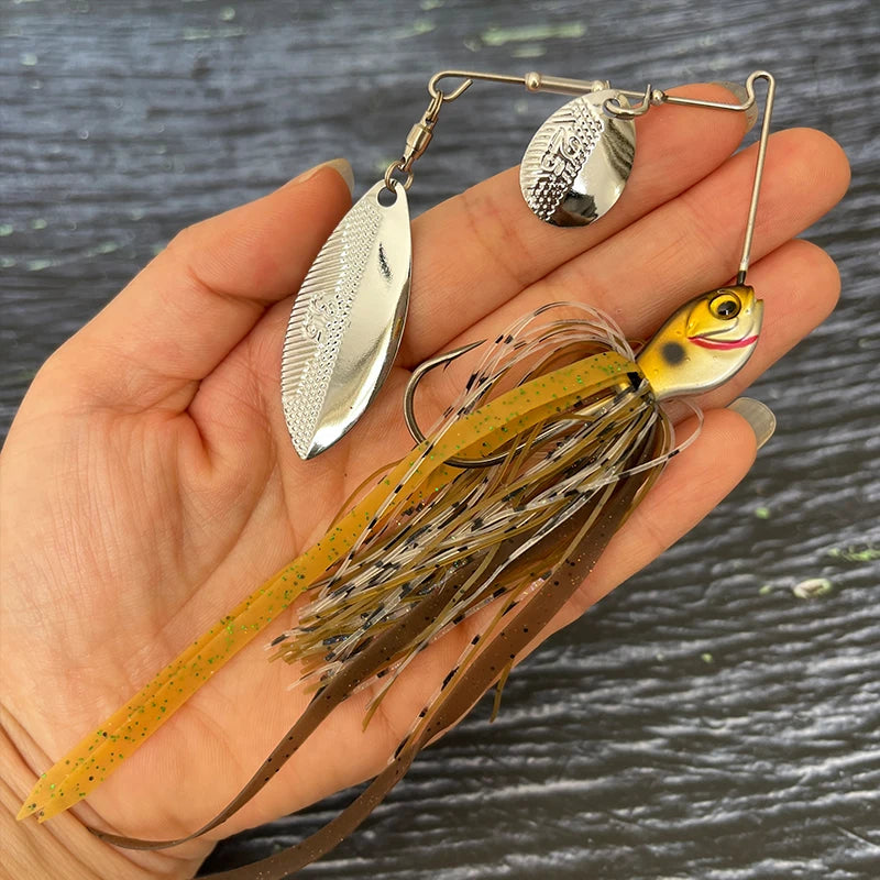 Hand holding a realistic fishing spinnerbait lure with metal blades and silicone skirt