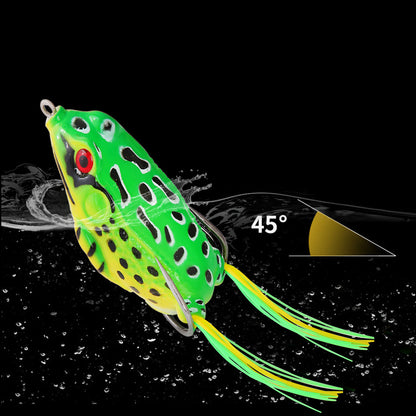 Realistic green frog fishing lure with red eyes and rubber legs on water, angled at 45 degrees