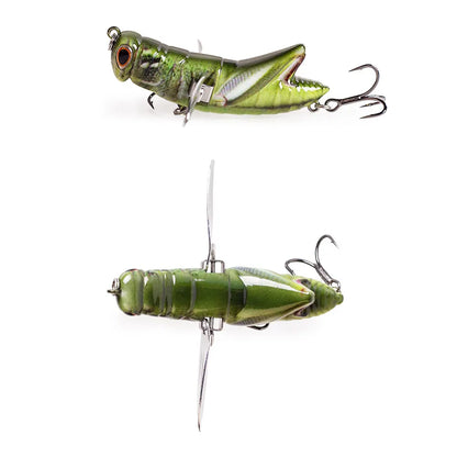 Realistic green grasshopper fishing lure with treble hooks and propeller wings on white background