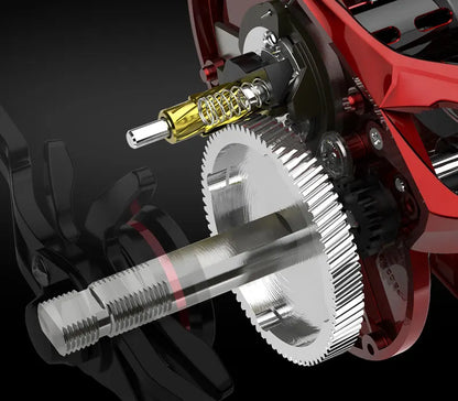 Close-up of a fishing reel gear system with metal components and red housing.