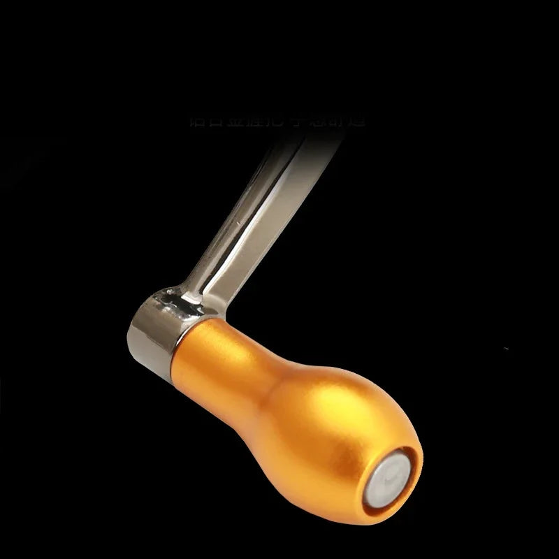 Orange metal fishing reel handle with chrome arm on black background