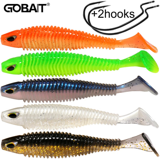 Colorful soft plastic fishing lures with ribbed bodies, paddle tails, and two hooks included