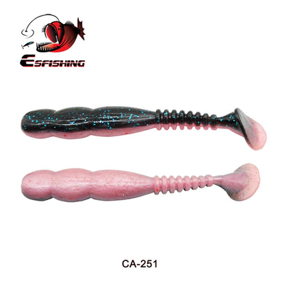 Two soft plastic fishing lures, one black with blue glitter and one pink, paddle tail design.