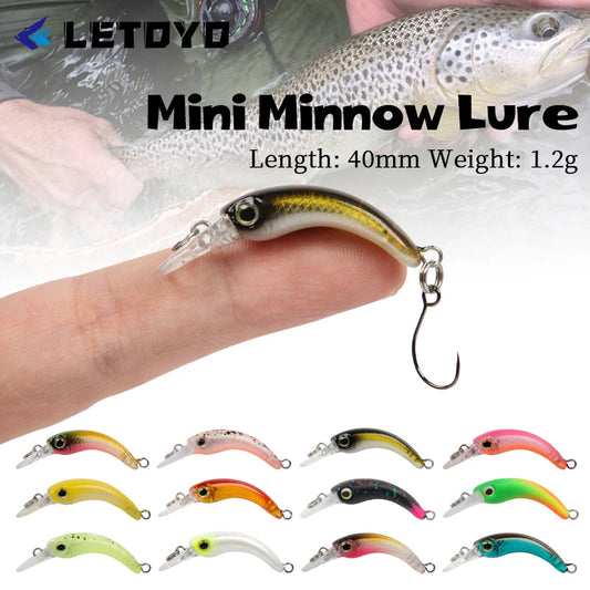 Assorted mini minnow fishing lures displayed with close-up of a lure on a finger, ideal for anglers.